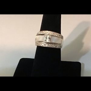 925 Sterling with Mother of Pearl & clear zirconias in a band style‎ ring.